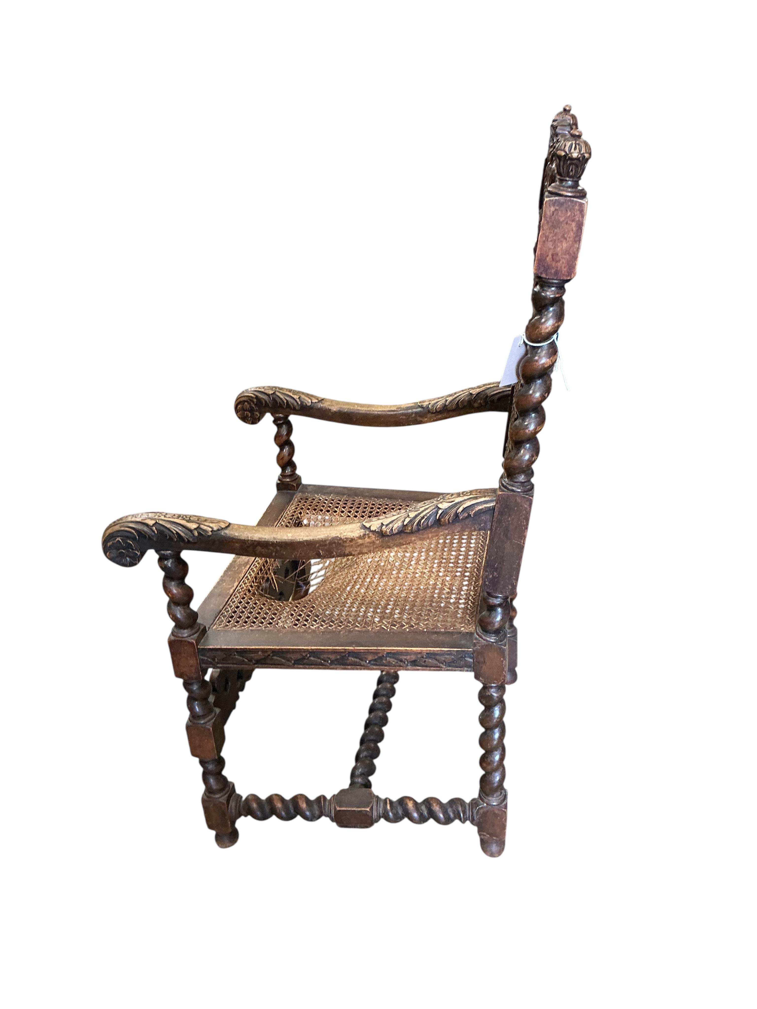 A Carolean style caned carved walnut elbow chair, width 61cm, depth 51cm, height 114cm